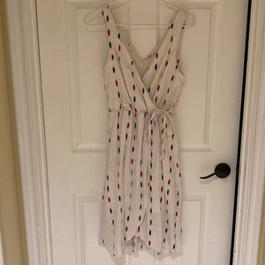 White wrap dress with blue and red design